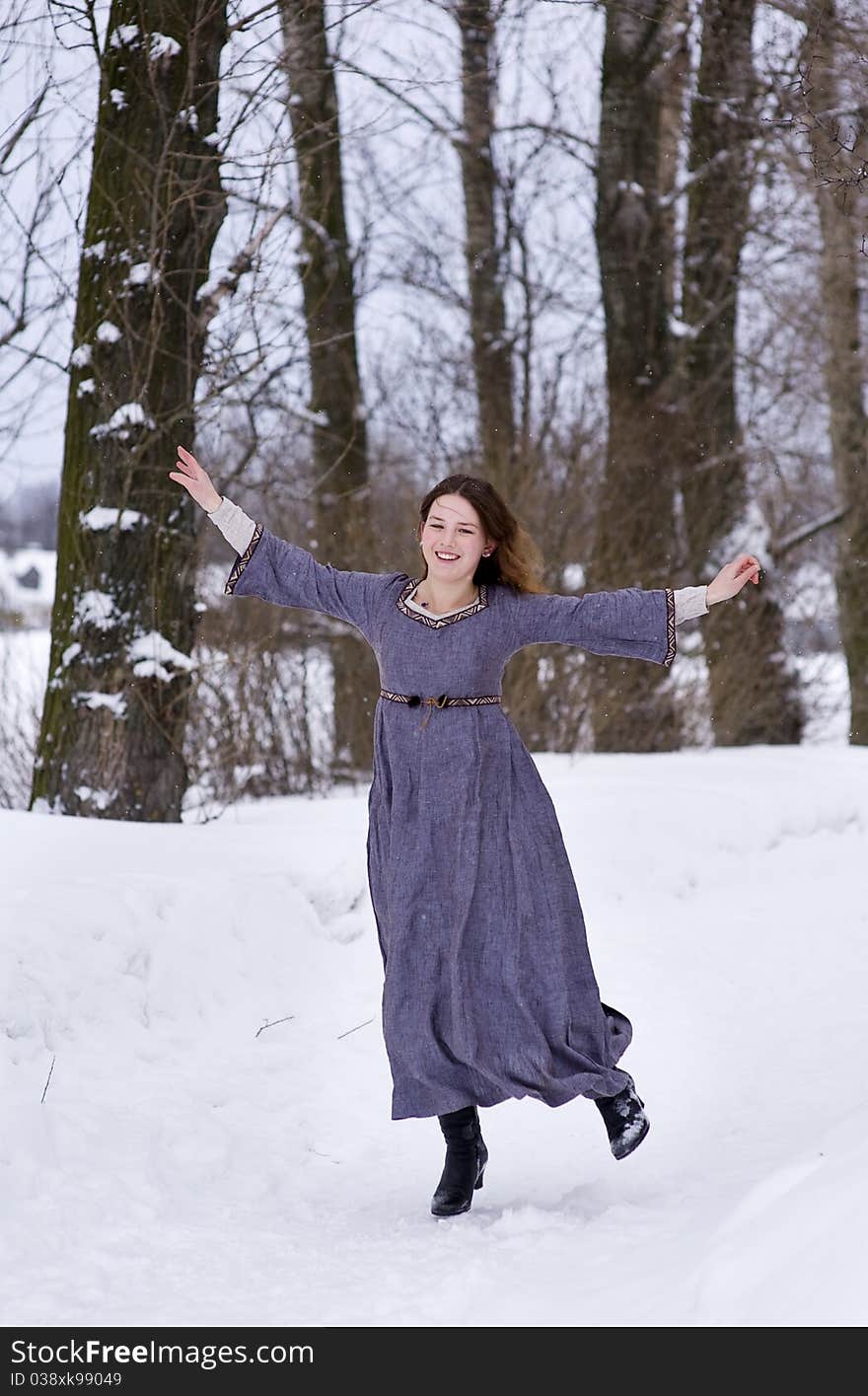 Dancing young girl in medieval dress. Dancing young girl in medieval dress