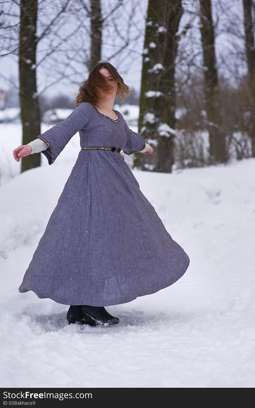 Dancing young girl in medieval dress. Dancing young girl in medieval dress