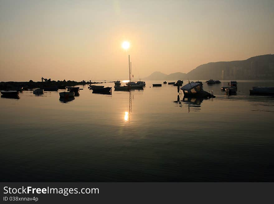 Sailing boats anchored with the sunset