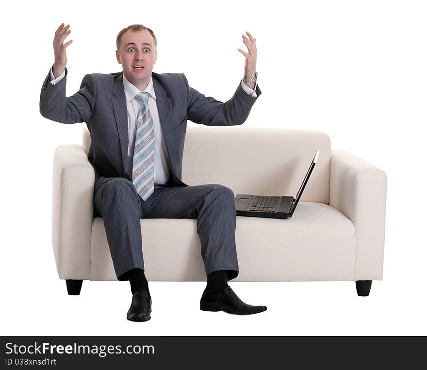 Businessman on the couch with a laptop