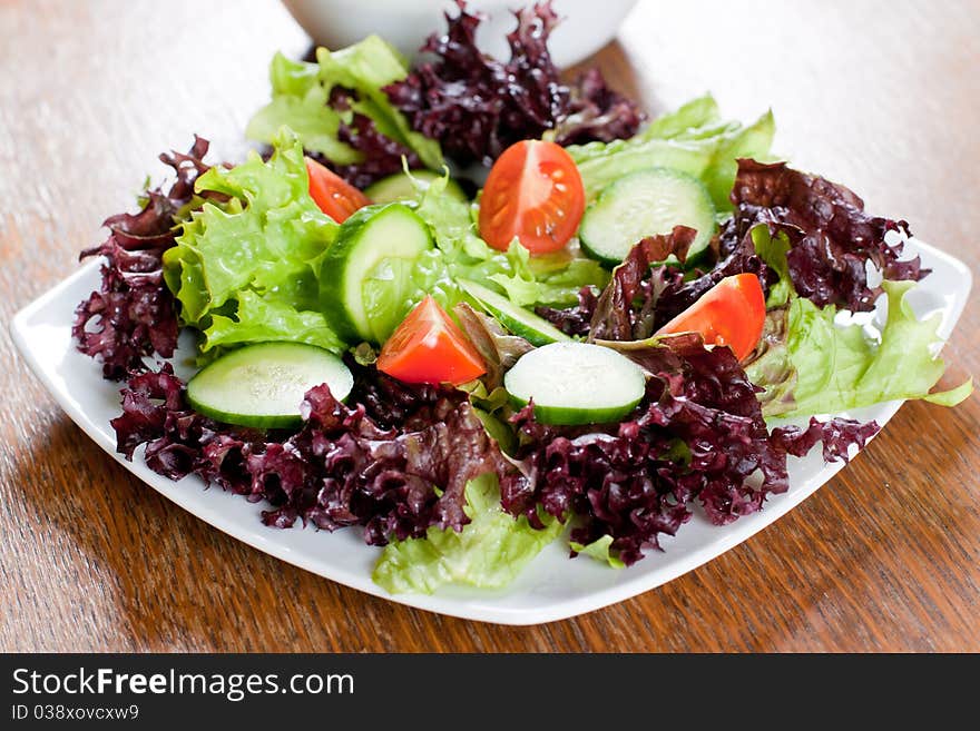 Healthy fresh salad setting on table.