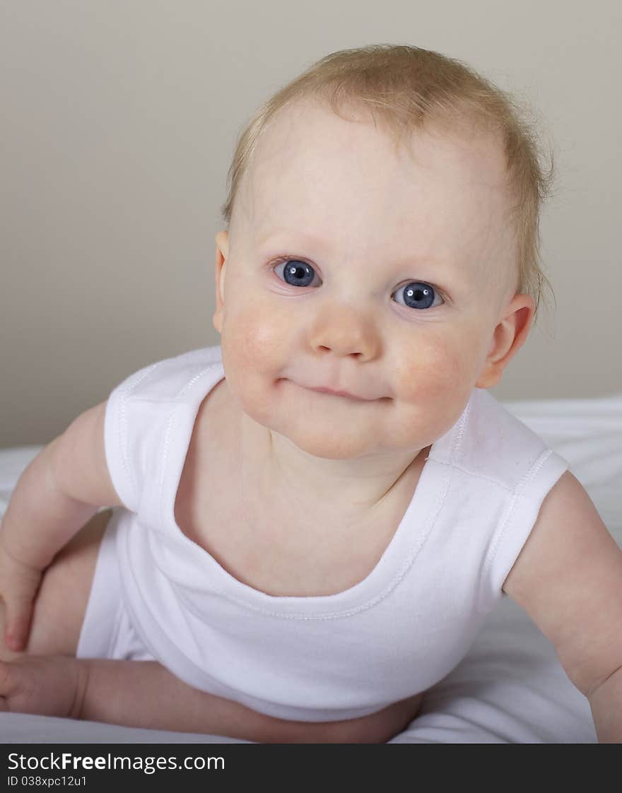 Cute baby boy smiling at camera