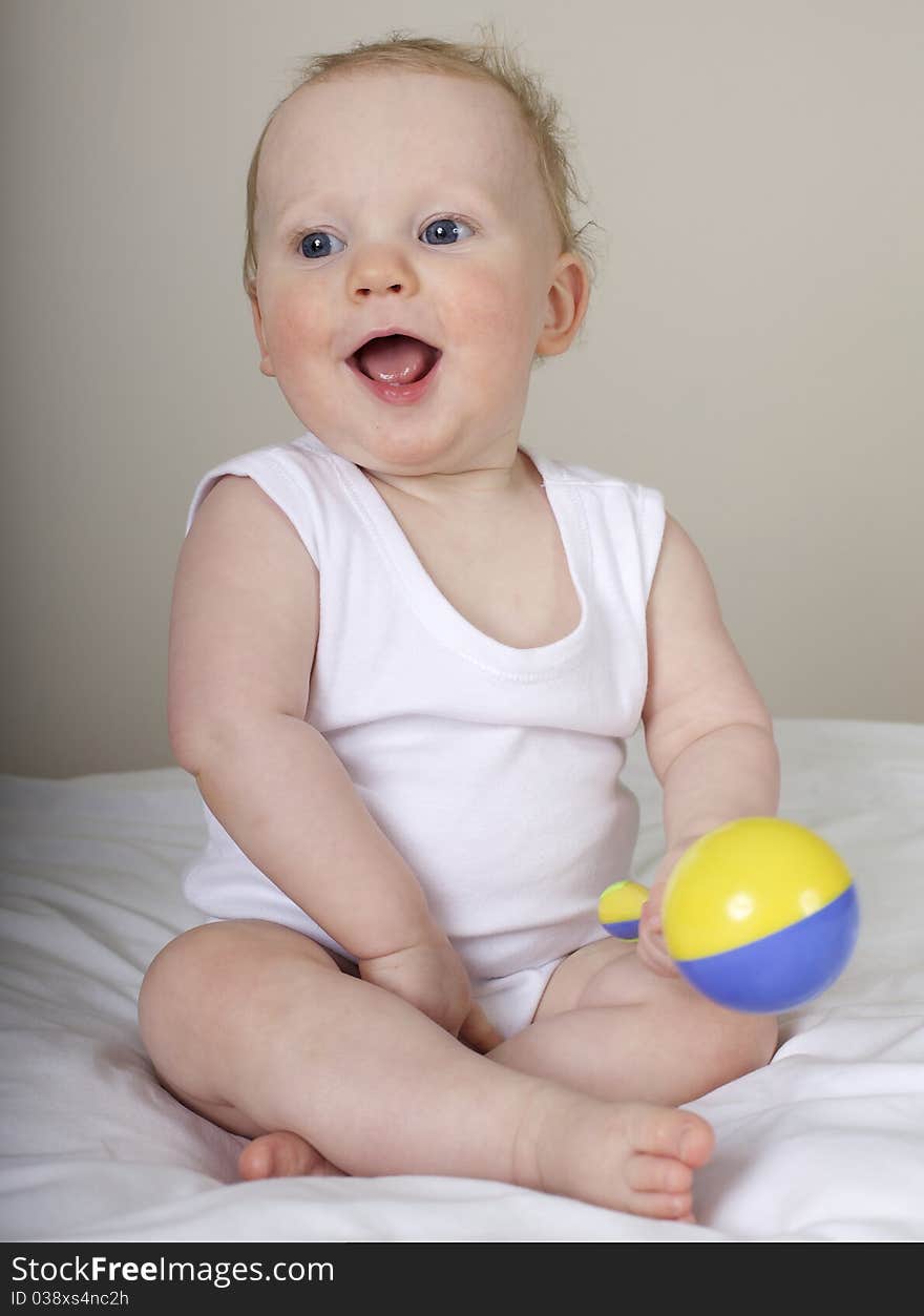 Cute baby boy playing and laughing. Cute baby boy playing and laughing