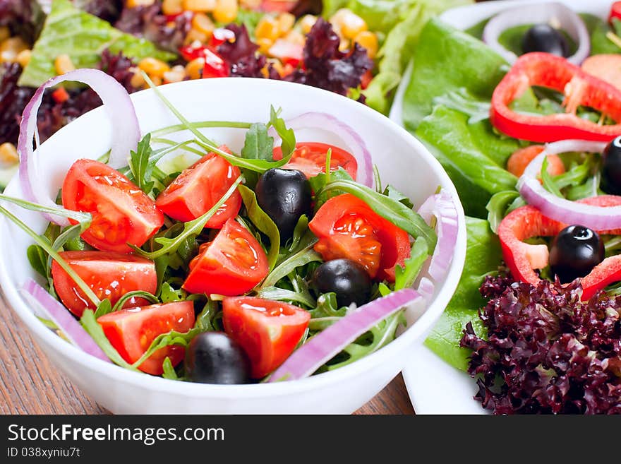 Healthy fresh salad setting on table.