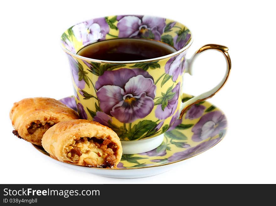 Cup Of Tea With Cookie On Saucer