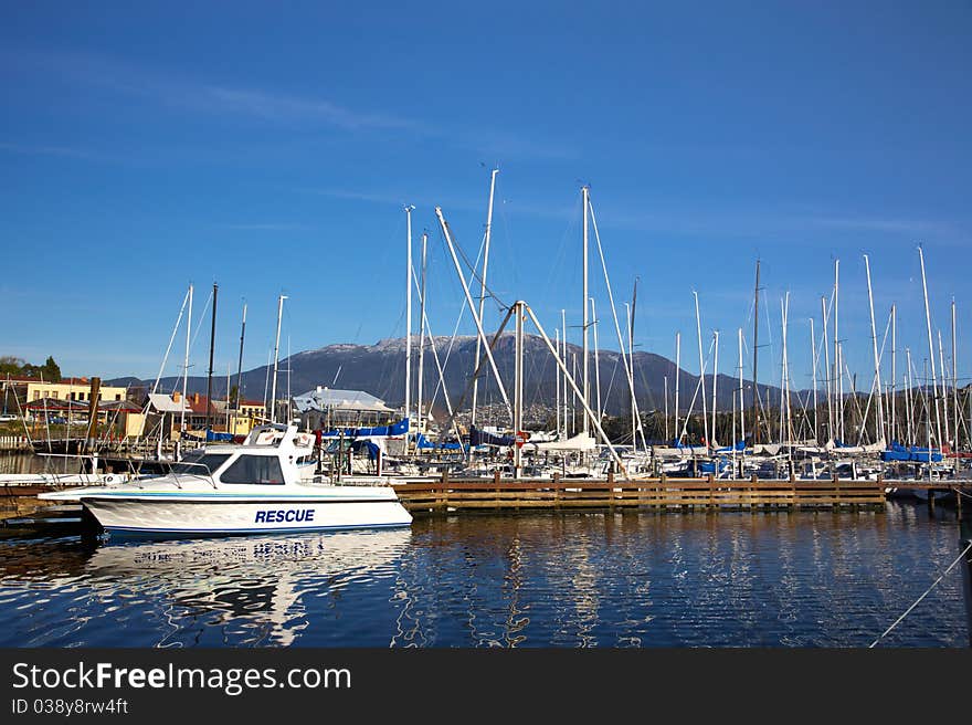 A rescue boat in the harbor, Mount Wellington on the horizon, in Tasmania.