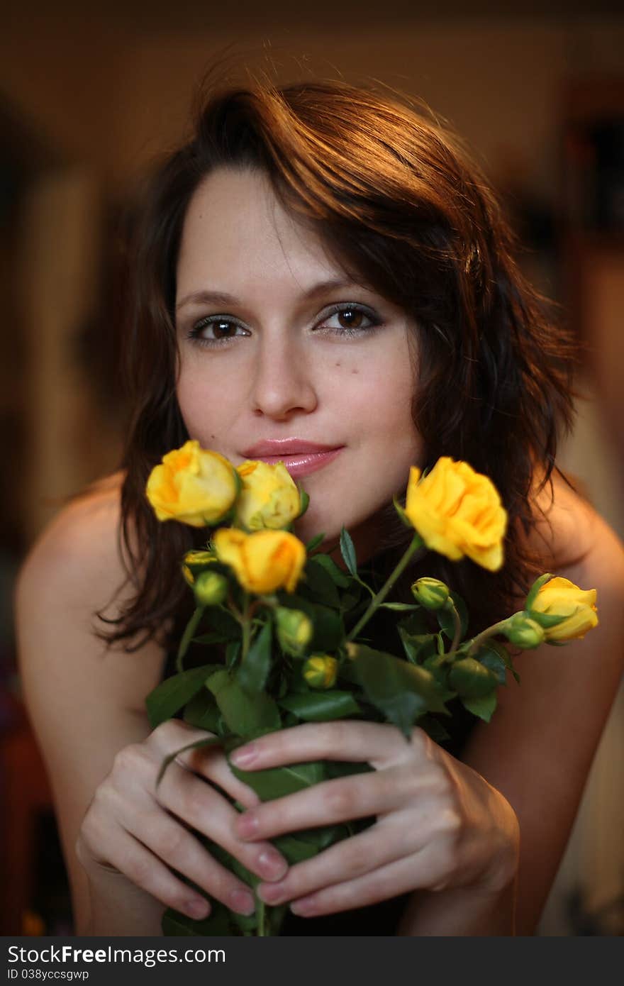 Portrait of the beautiful girl with a bouquet of yellow roses. Portrait of the beautiful girl with a bouquet of yellow roses