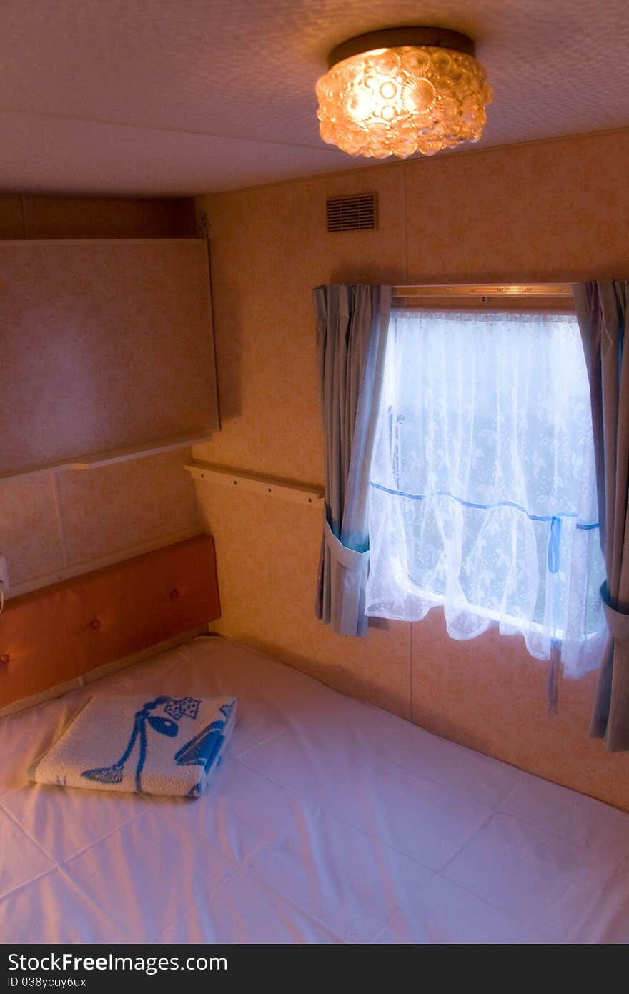 Overhead view of a comfortable, romantic mobilehouse or trailer bedroom. Overhead view of a comfortable, romantic mobilehouse or trailer bedroom.