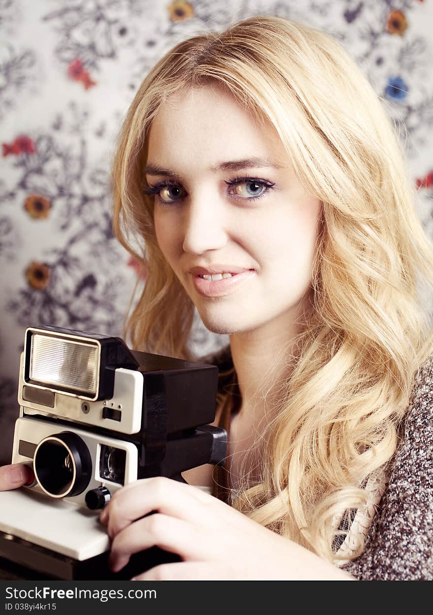 Beautiful young woman with camera. Beautiful young woman with camera