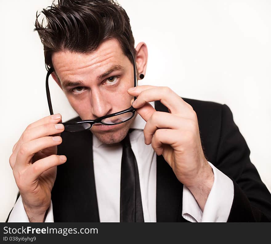 Young Businessman Holding Black Glasses