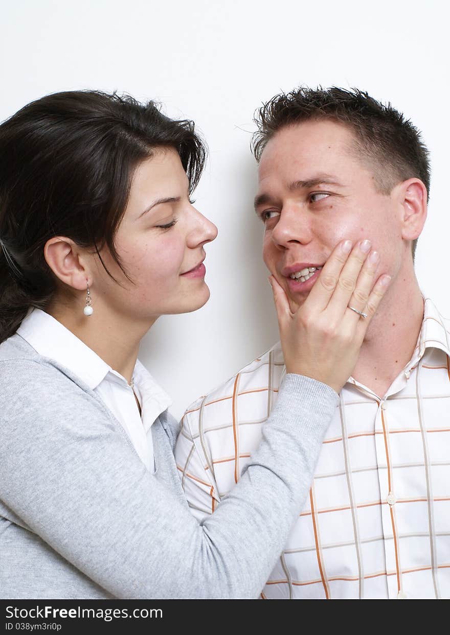 Young woman touches her husband's face. Young woman touches her husband's face