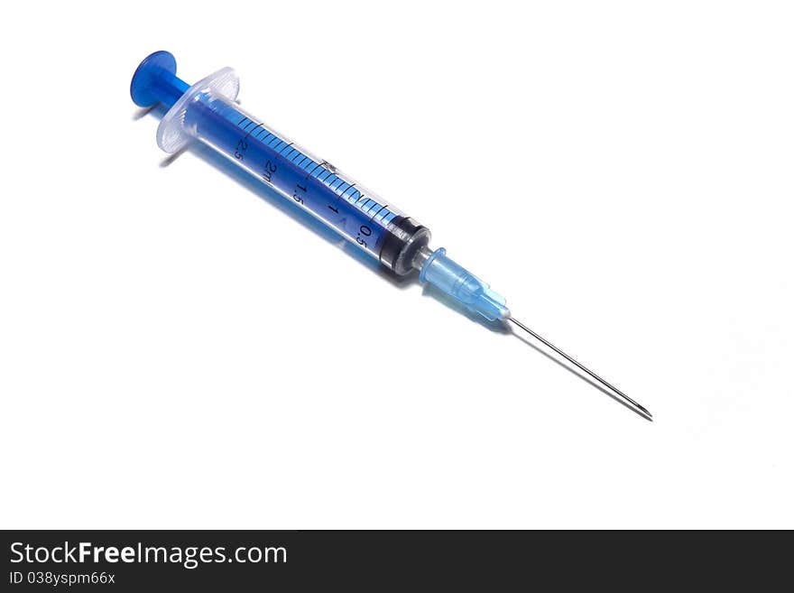 Dark blue plastic disposable syringe on a white background. Dark blue plastic disposable syringe on a white background