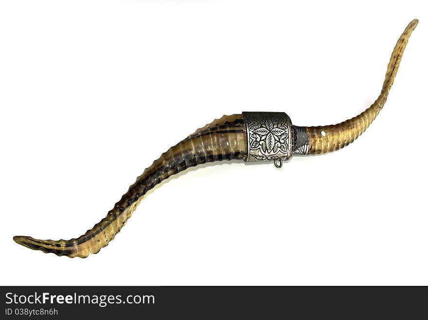 The image of a decorative dagger in its sheath on a white background