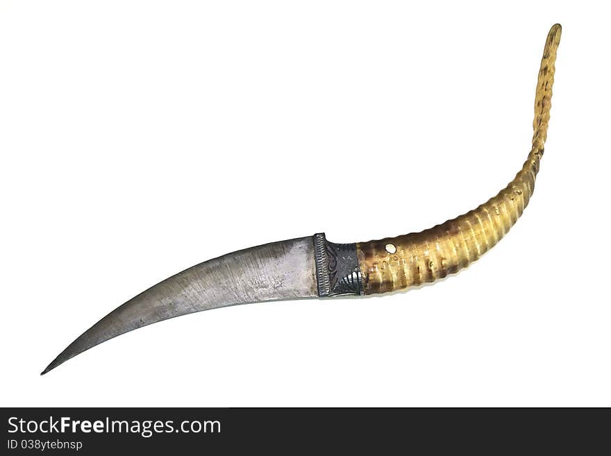 A decorative dagger without its sheath on a white background