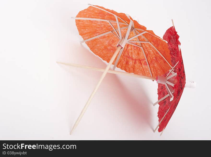 Paper umbrellas to decorate the glasses with a cocktail.