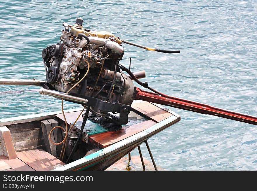 Close up of engine of long tailed boat.