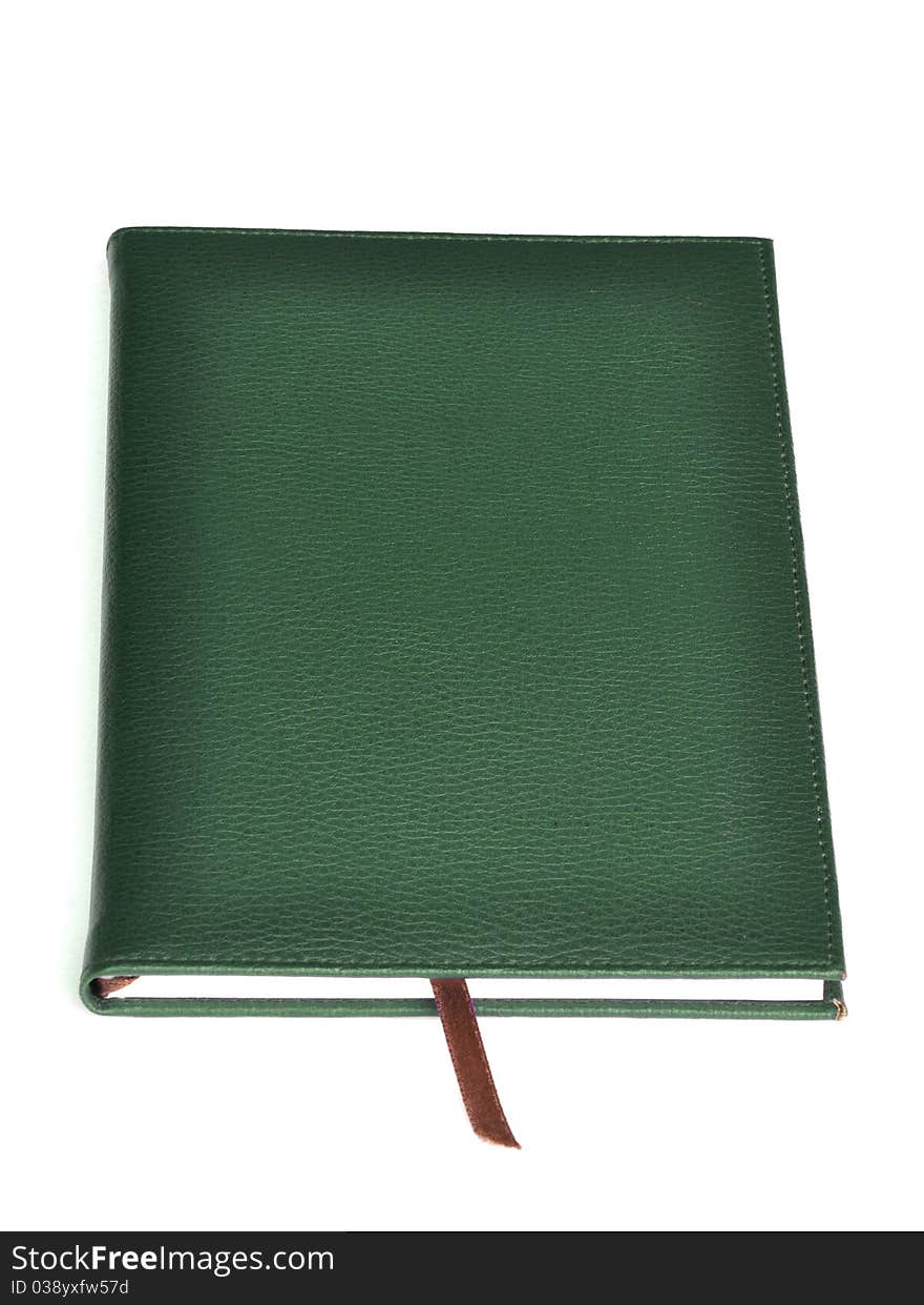 Dark green leather notebook on white background.