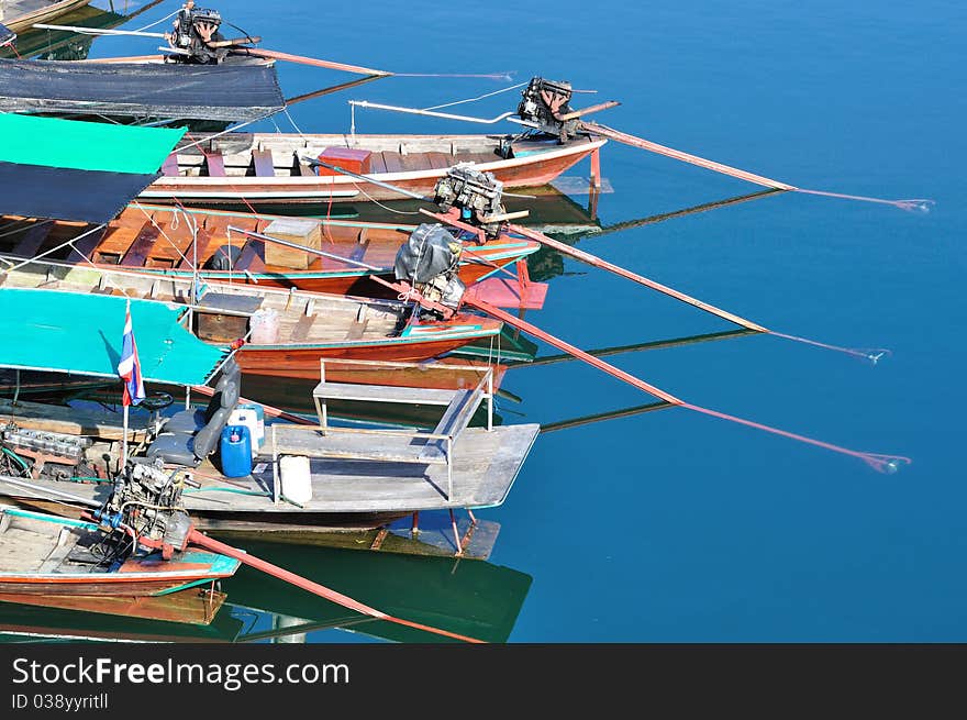 Behind of group of long tailed boat floating on lake