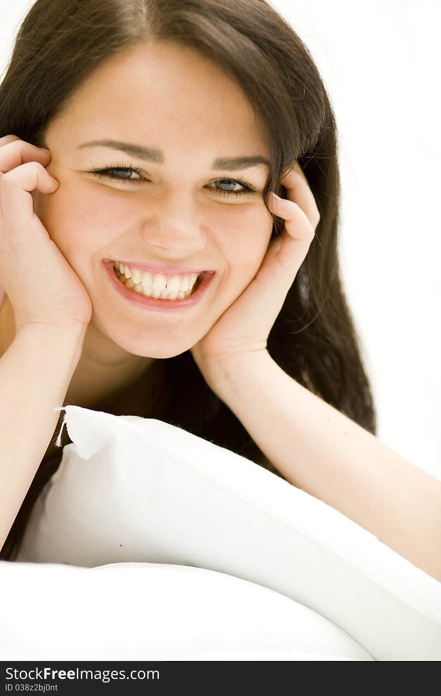 Woman laying down, relaxing in her bed