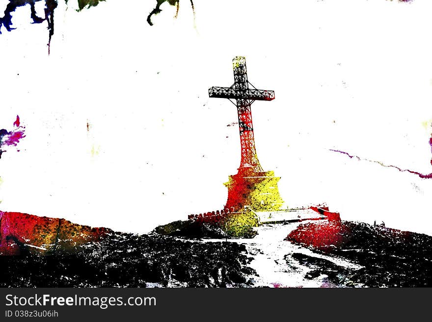 Metal cross monument standing on a hillside