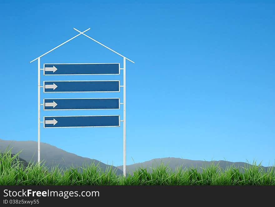 Signpost with mountain and blue sky