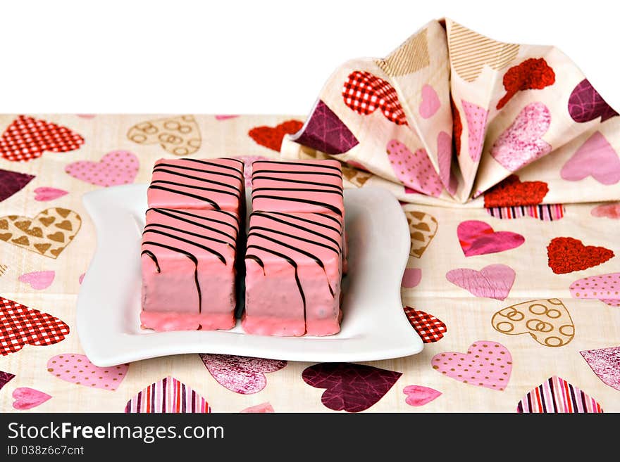 Pink cakes on white ceramic plate