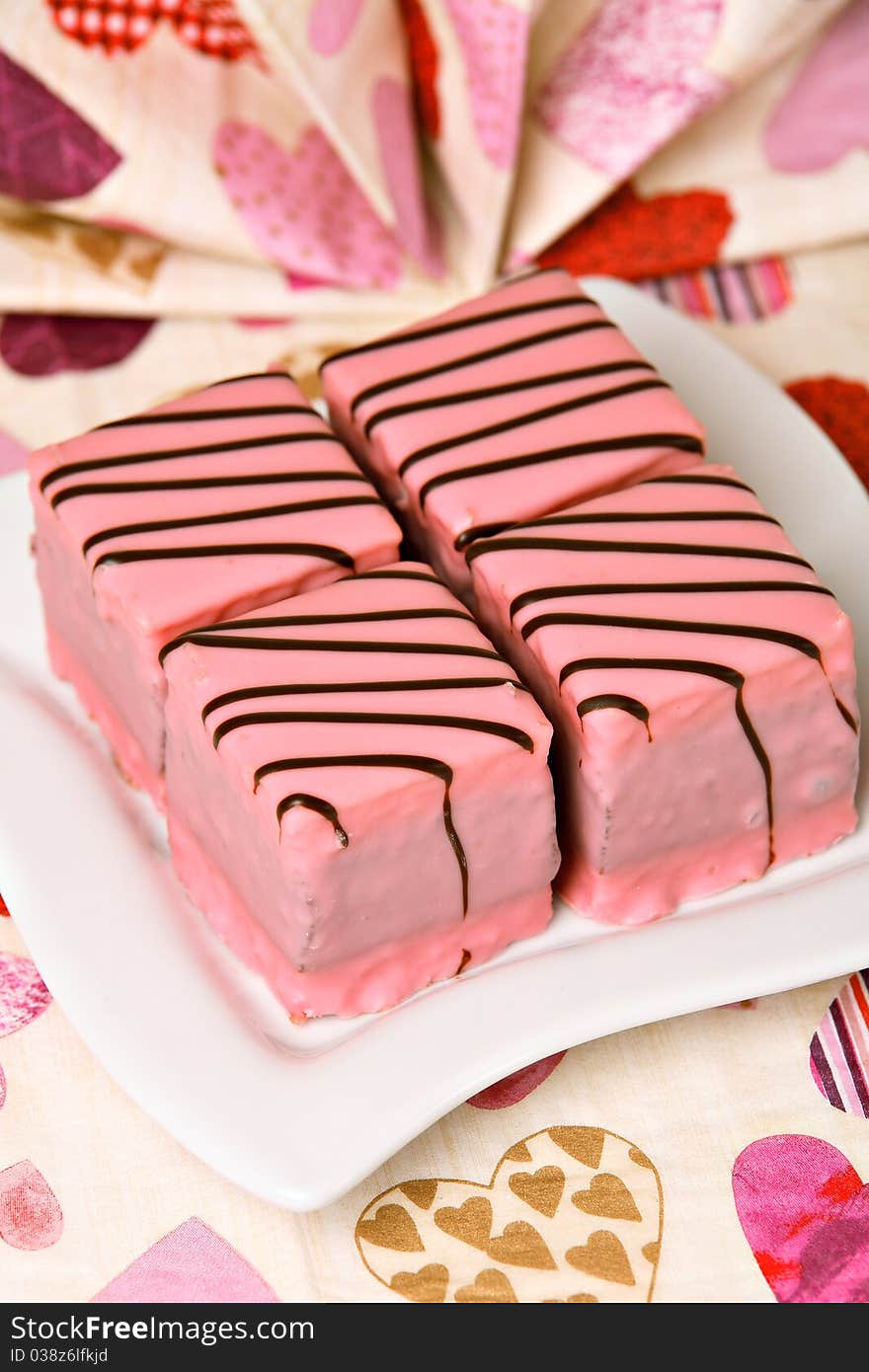 Pink cakes on white ceramic plate