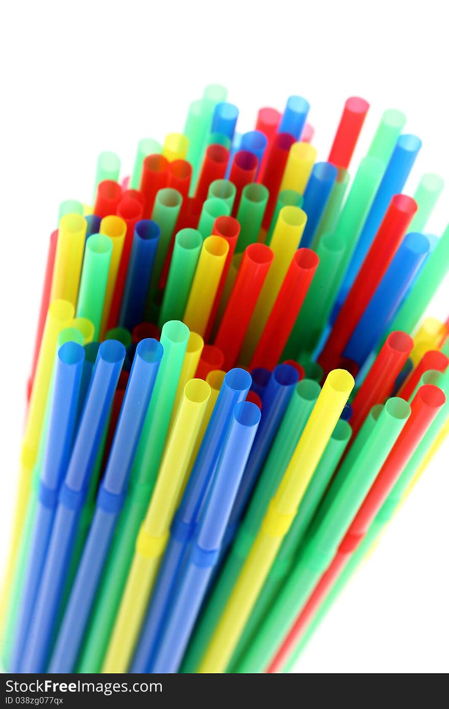 Colorful drinking straws. Focus on foreground. Isolated on white background