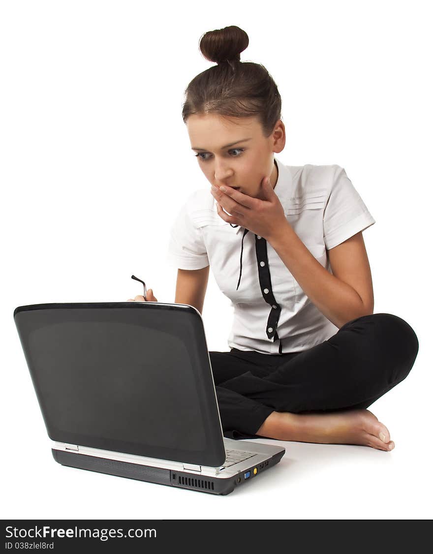 Beautiful girl sitting on the floor and works on a laptop keep the glasses in her hand isolated on white background Student Series