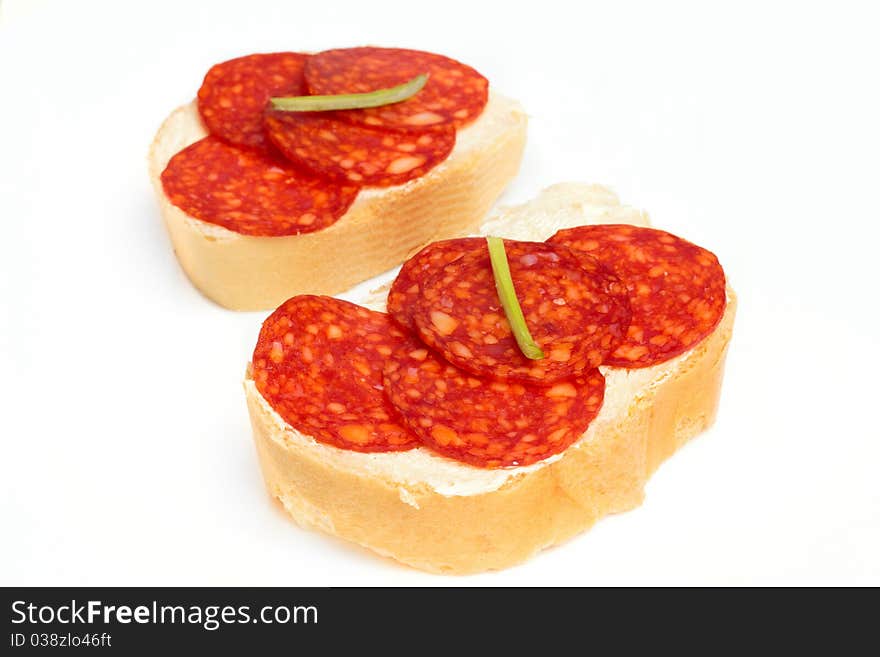 Shot of Bread and salami isolated on white