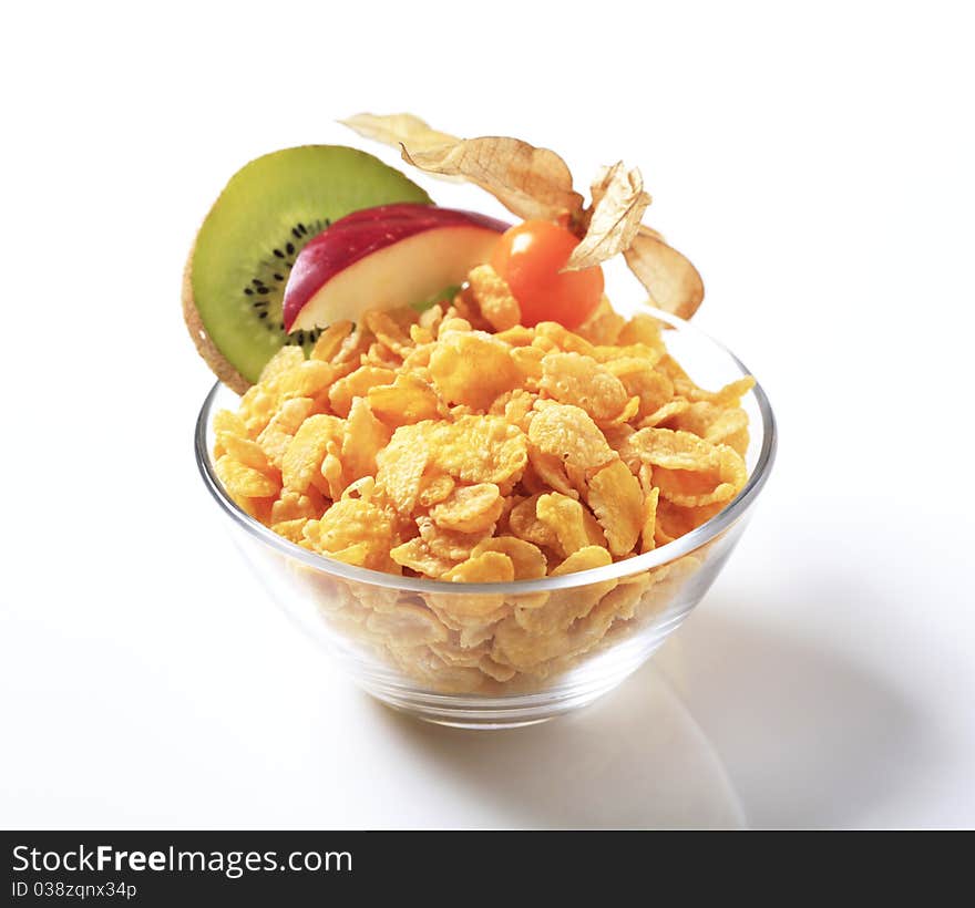 Bowl of corn flakes and fresh fruit