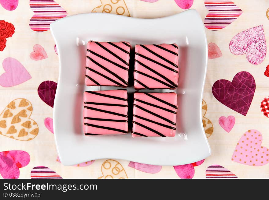 Pink cakes on white ceramic plate