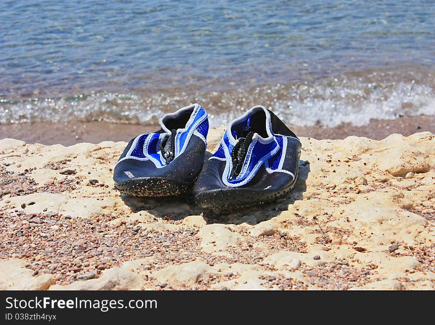 Swimming shoes on stone