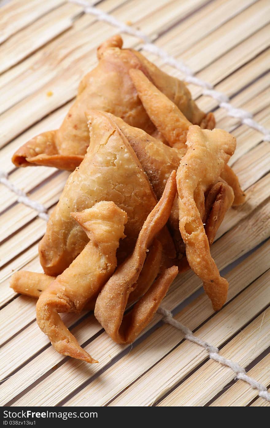 Closeup shot of fried samosas and matri. Closeup shot of fried samosas and matri.