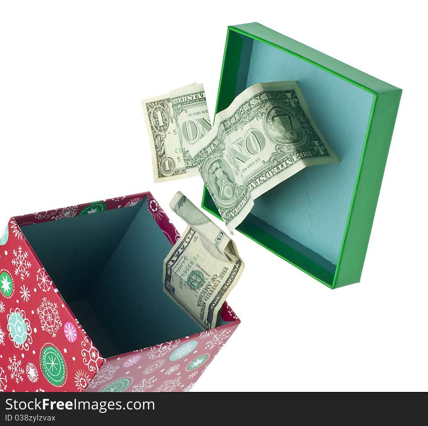 Open Holiday Box with Dollar Bills Spilling Out. Isolated on White with a Clipping Path. Open Holiday Box with Dollar Bills Spilling Out. Isolated on White with a Clipping Path.