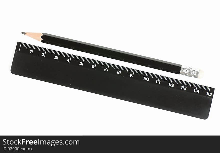 Black ruler and pencil isolated on the white. Black ruler and pencil isolated on the white