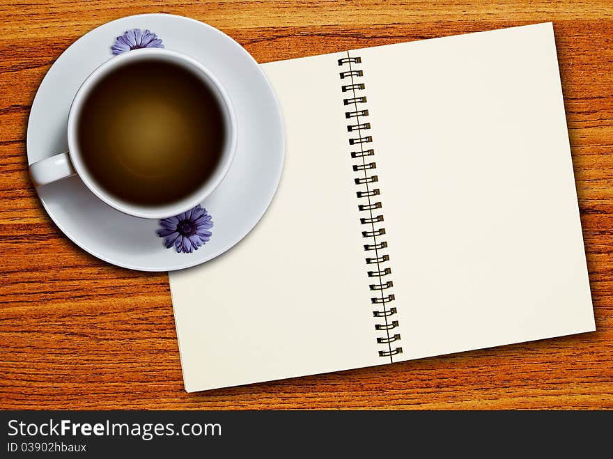 White Cup Of Coffee And Notebook