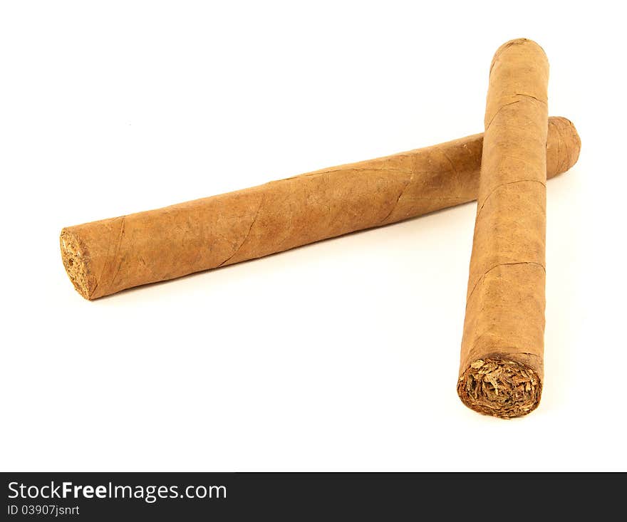 Two hand rolled cuban cigars on white background. Two hand rolled cuban cigars on white background