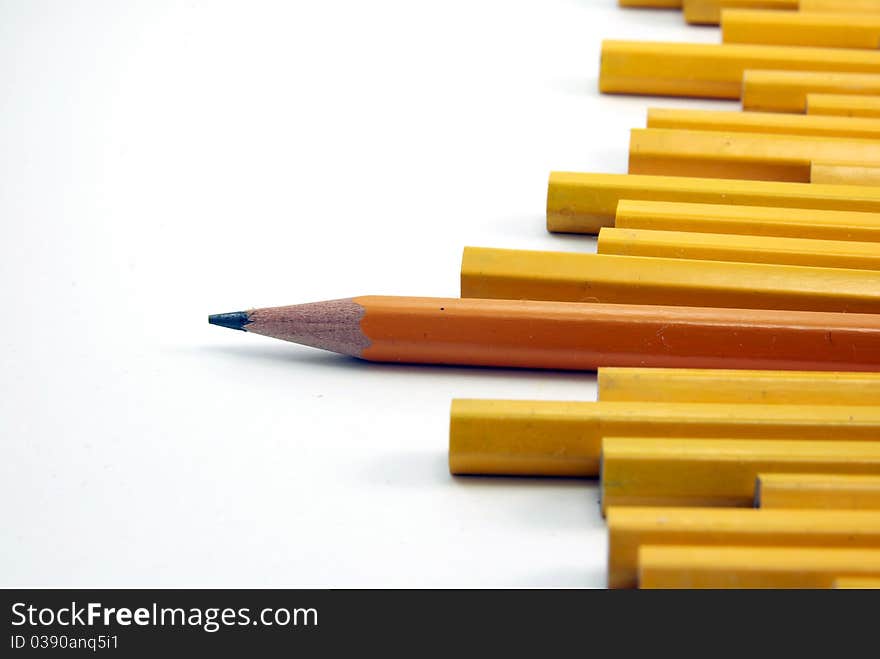 Yellow pencils arranged against a white background.