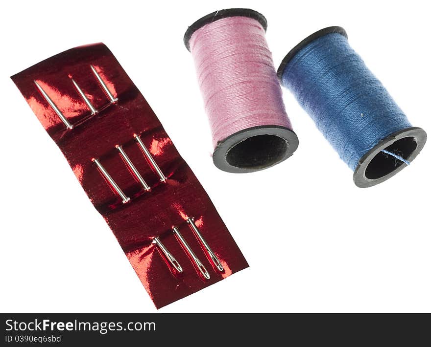 Pink and Blue Thread with Needles Isolated on White with a Clipping Path.