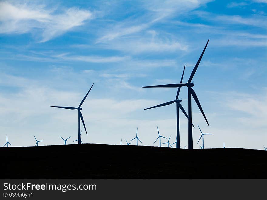 A Wind Farm with blue sky and clouds