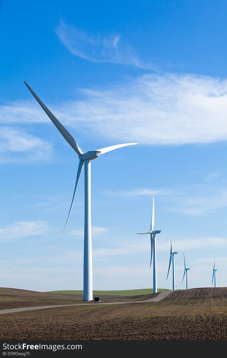 A Wind Farm with blue sky and clouds