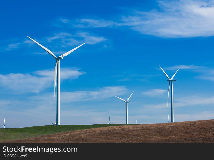 A Wind Farm with blue sky and clouds