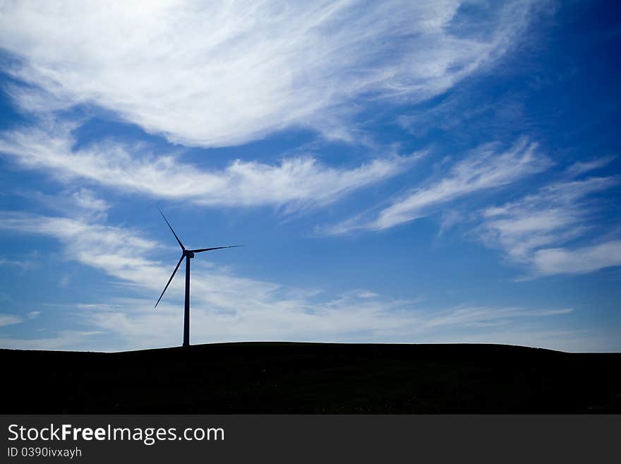 A Wind Farm with blue sky and clouds