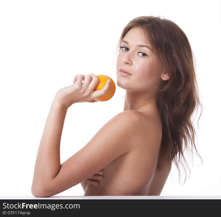 The woman with an orange fruit