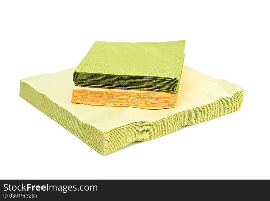 Green and yellow napkins isolated on a white background. Green and yellow napkins isolated on a white background.