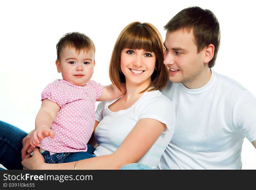 Happy family with a baby on a color background