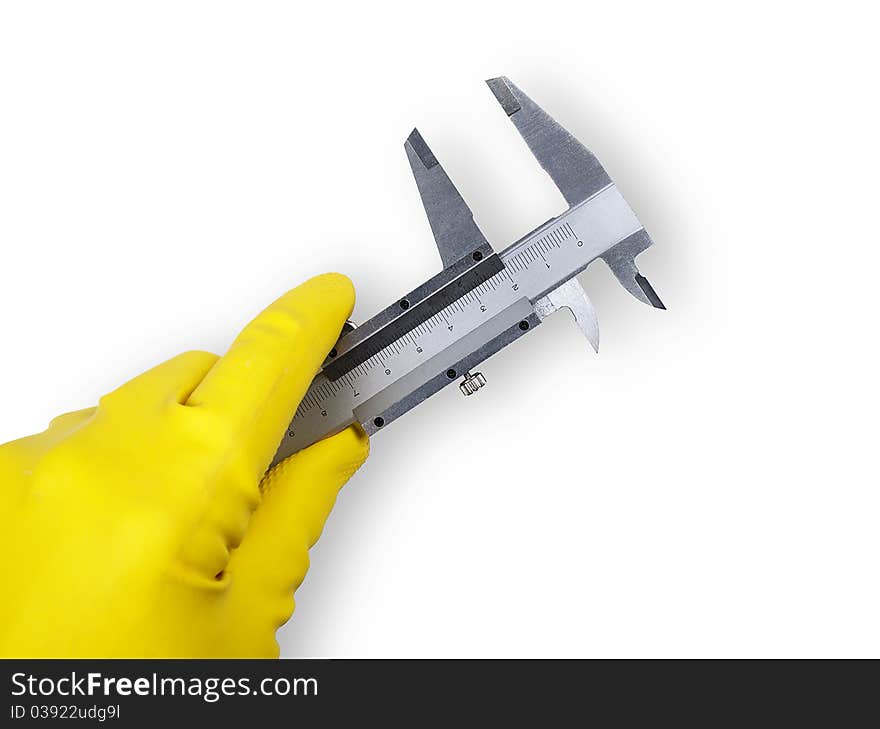 The image shows a human hand with a rubber glove and a sliding gauge over white. The image shows a human hand with a rubber glove and a sliding gauge over white