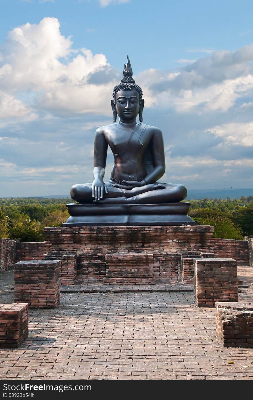 Buddha with blue sky in Thailand.