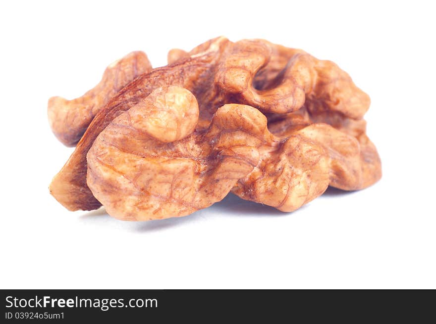 Peeled walnut on white background